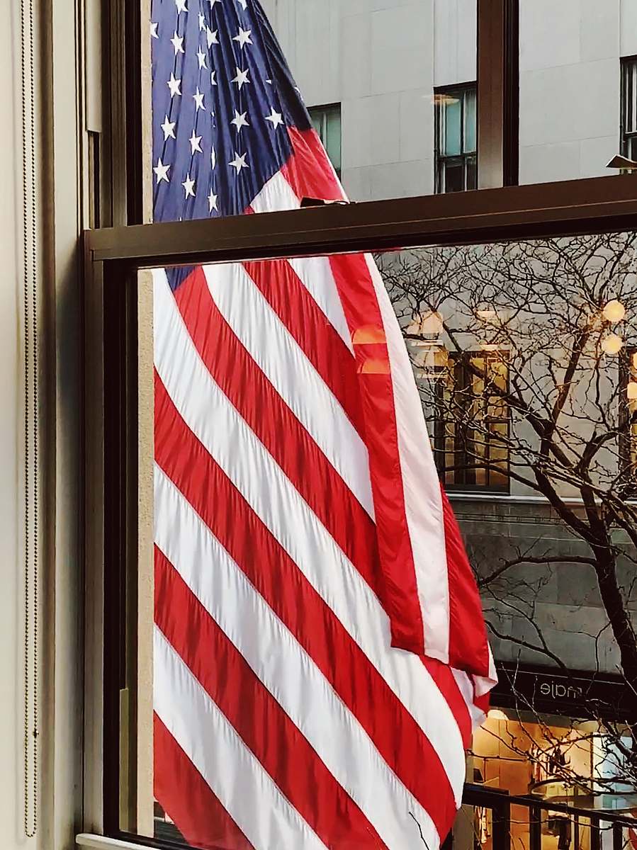 american flag American flag outside window symbol